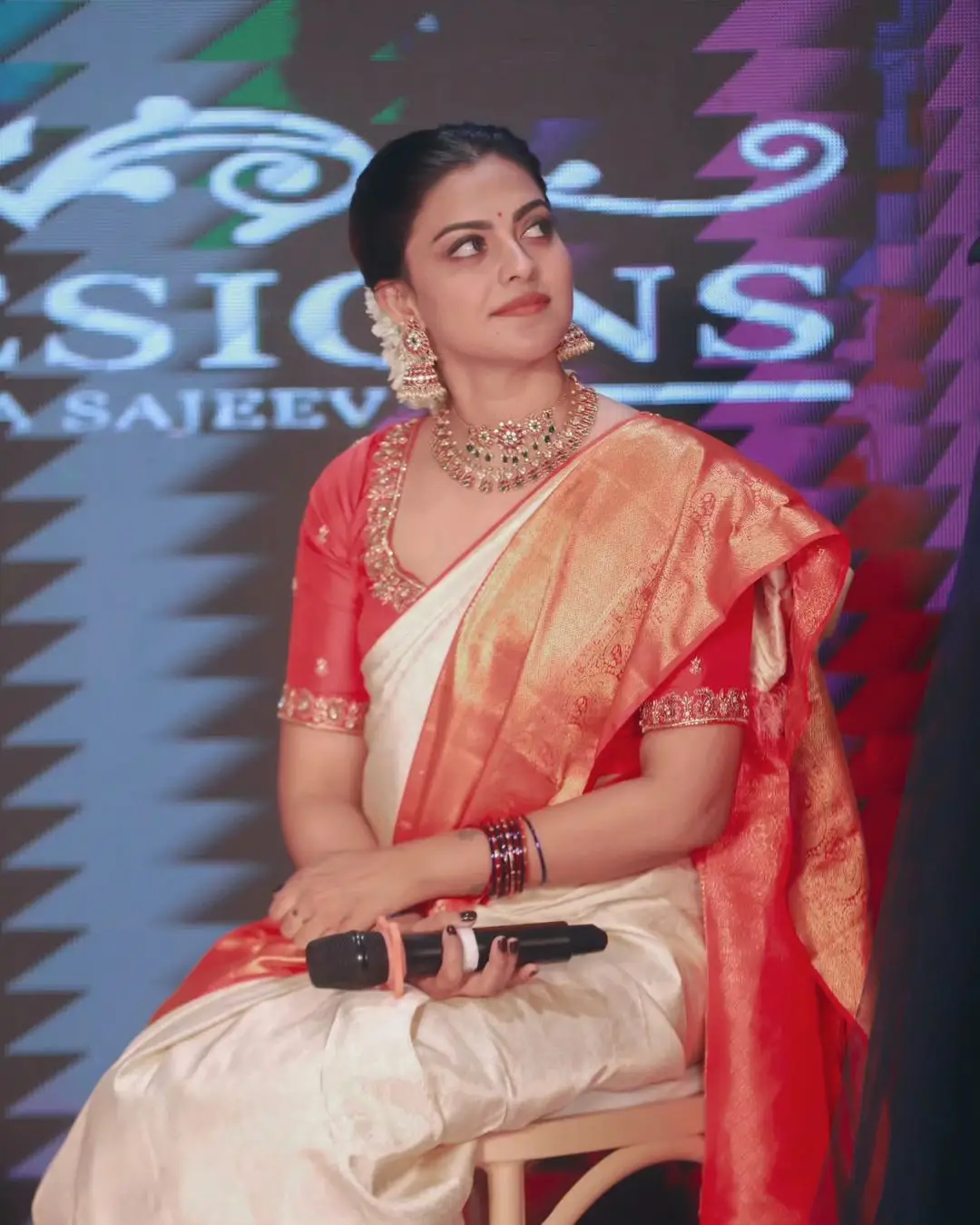 Anusree Nair Wearing Beautiful Earrings Jewellery White Saree Orange Blouse